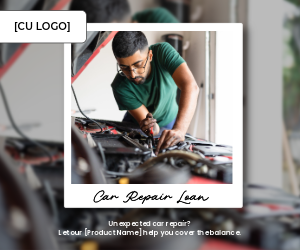A man uses a tool to work on the engine of a car.