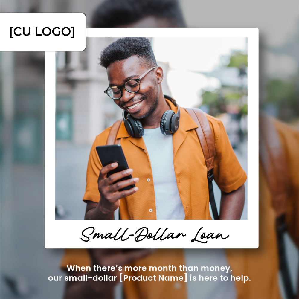 A young man smiles while looking at his cell phone. He has a backpack on and headphones wrapped around his neck.